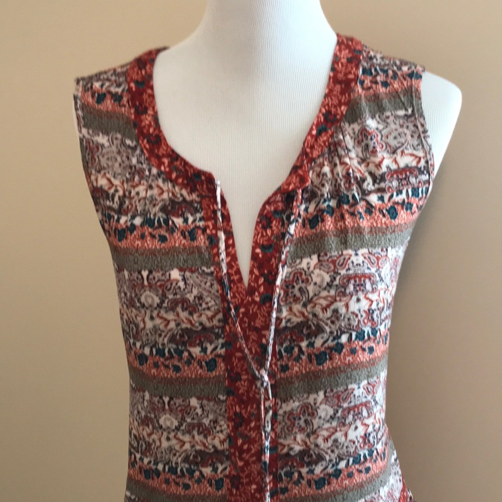 Peplum hem sleeveless top